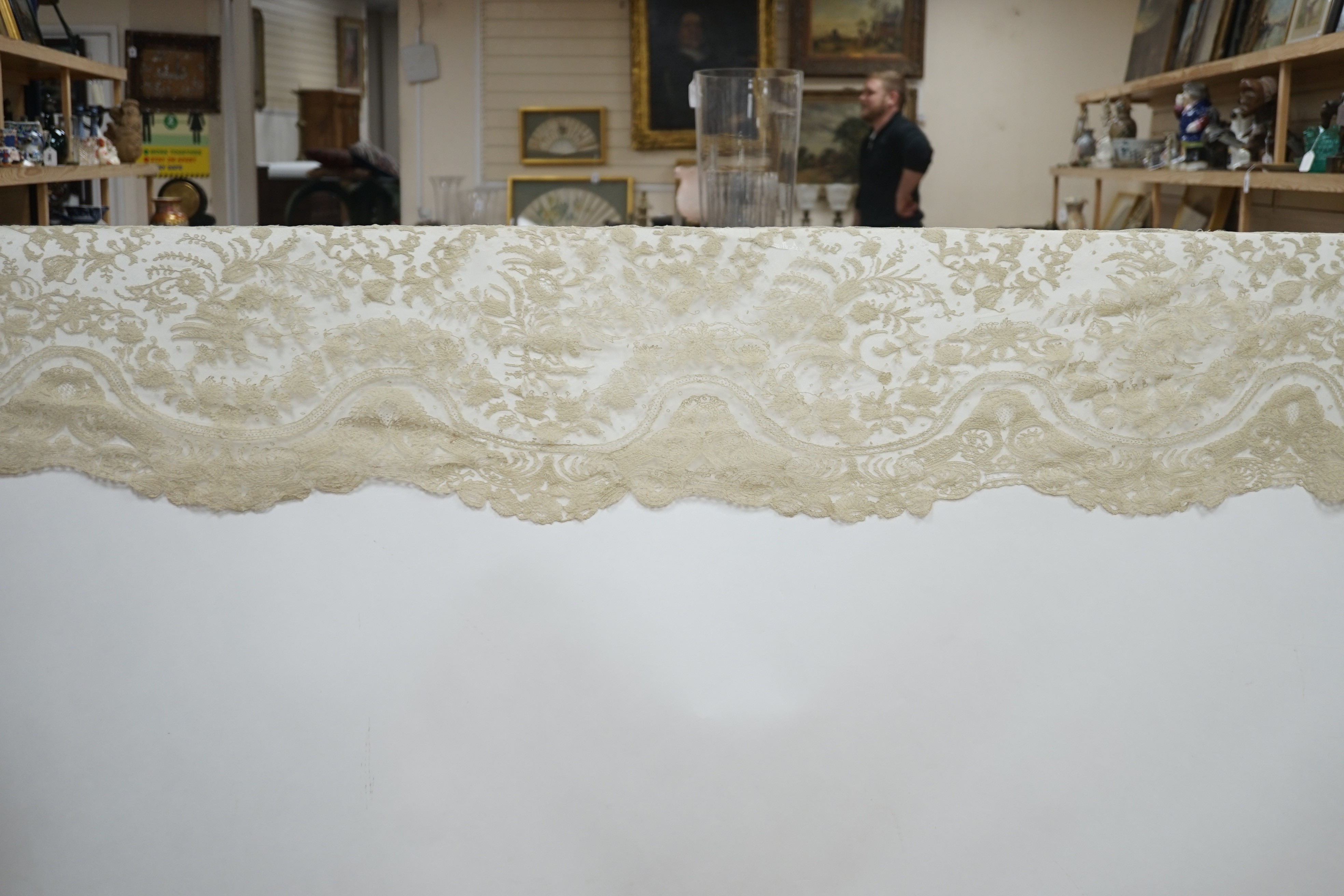 A rare length (9 and a half yards) of Brussels 19th century needle lace, some repairs and damage, circa 1880 and a similar wedding veil
